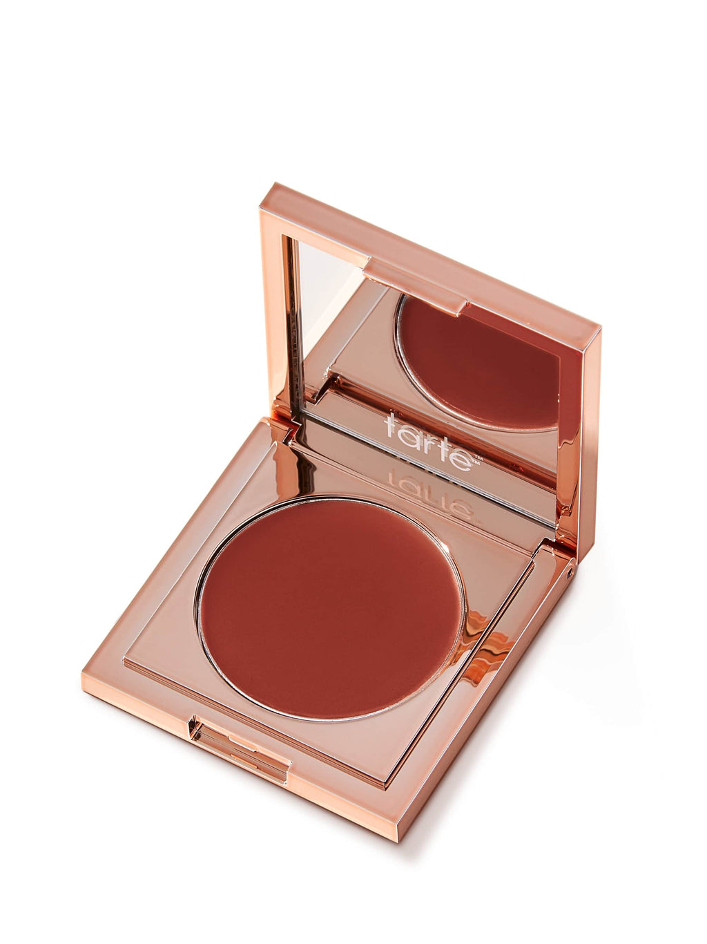 Open makeup compact with blush shade and 'tarte' branding on a white background